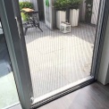 Hordeur plaatsen van keuken naar terras
